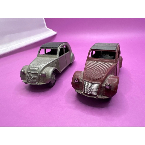 135 - 2x dinky toys, unbox models, Citroen, 2CV, one in grey one in burgundy.