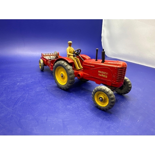 152 - Dinky Unboxed Massy Harris Tractor and manure Spreader in red.