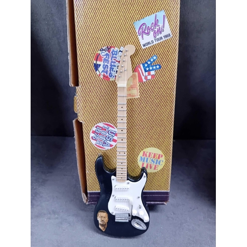 415 - Miniature collectable guitars   2 x Elvis Presley   1 x Jimmy Hendrix   1 x Eric Clapton   1 x Buddy... 