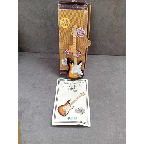 415 - Miniature collectable guitars   2 x Elvis Presley   1 x Jimmy Hendrix   1 x Eric Clapton   1 x Buddy... 