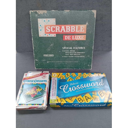 1039 - Mix lot of 3 board games this lot consists of Scrabble Deluxe, Deluxe Crossword and Chinese Checkers