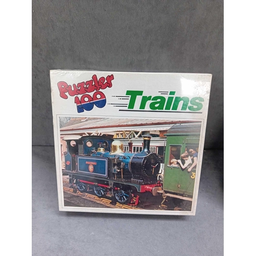 609 - 5 x transport themed puzzles    4 x trains    1 x boats