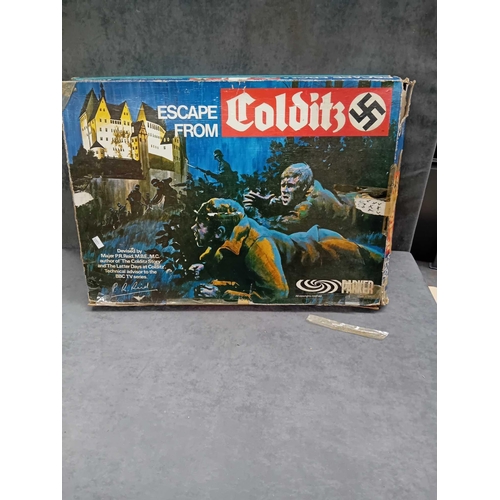 615 - 2 x vintage board games   1 x Waddington go international travel game   1 x escape from colditz