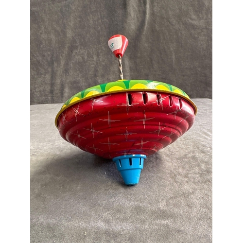 71 - 2 Tin Toy spin tops