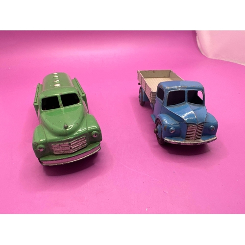 306 - 2 Dinky Toys Unboxed Petrol Truck In Green And Dodge Tipper Lorry 414 In Blue And Grey.