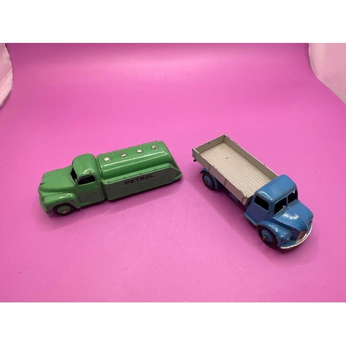 306 - 2 Dinky Toys Unboxed Petrol Truck In Green And Dodge Tipper Lorry 414 In Blue And Grey.