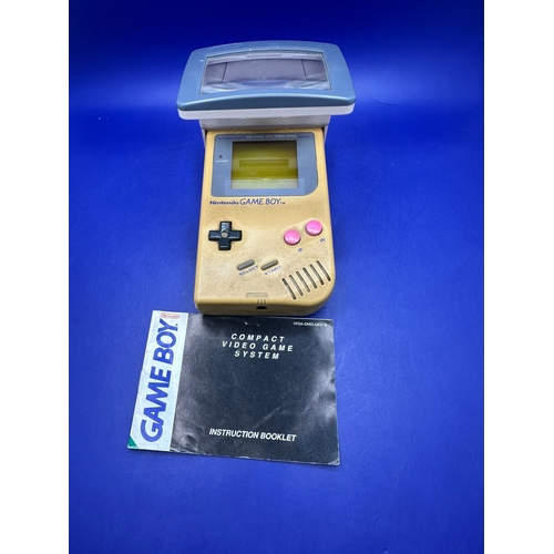 30 - Original GameBoy in Gold Model DMG - 01 Comes With Light Magic Magnifing Glass.