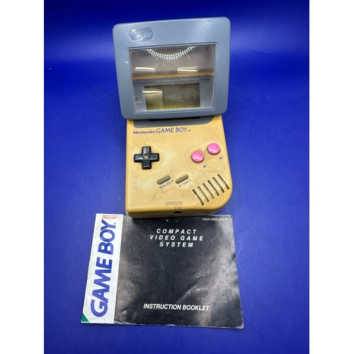 30 - Original GameBoy in Gold Model DMG - 01 Comes With Light Magic Magnifing Glass.