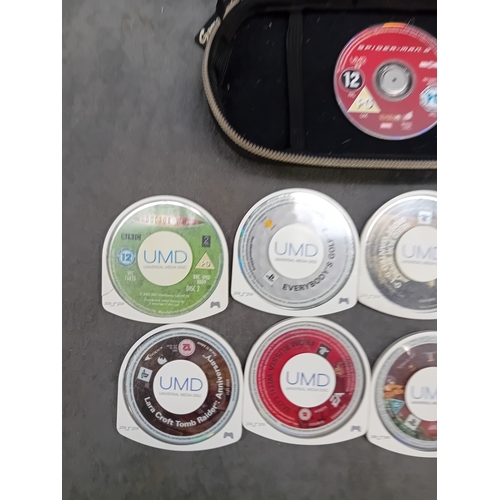 Mixed lot of PSP games in a PSP case as pictured there are a total of 9 ...