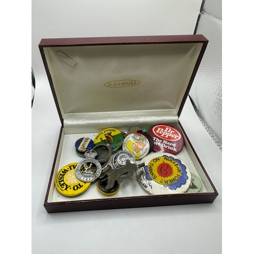 143 - A collection of 20 assorted vintage pins and badges, predominantly mid-20th century tin-plate and en... 