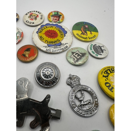 143 - A collection of 20 assorted vintage pins and badges, predominantly mid-20th century tin-plate and en... 