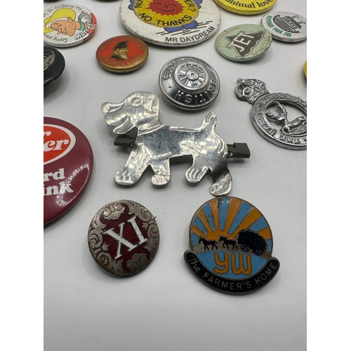 143 - A collection of 20 assorted vintage pins and badges, predominantly mid-20th century tin-plate and en... 
