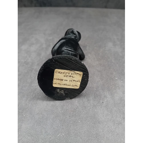219 - A figurine by 'Crafty with Coal', crafted from Welsh coal. The piece depicts an anthropomorphic pig ... 
