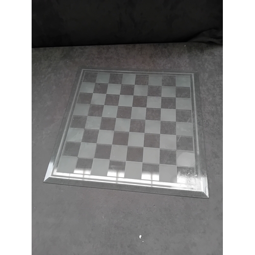 235 - This lot comprises two distinct modern game boards, each constructed from clear glass with frosted e... 