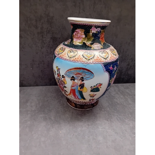 239 - A Mid 20th Century Chinese Famille Rose hand painted porcelain baluster vase. The vase features exte... 