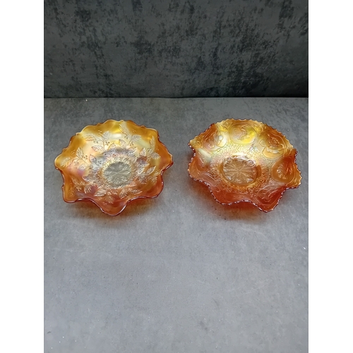 250 - A pair of Fenton Marigold Carnival Glass bowls, comprising one in the Dragon & Lotus pattern and... 