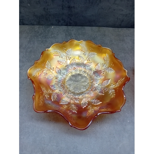 250 - A pair of Fenton Marigold Carnival Glass bowls, comprising one in the Dragon & Lotus pattern and... 