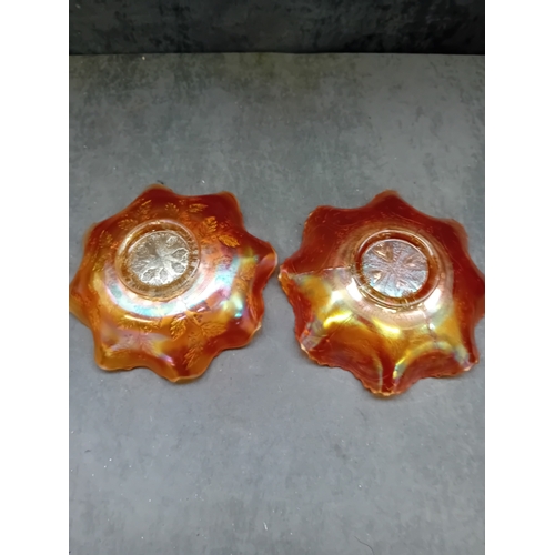 250 - A pair of Fenton Marigold Carnival Glass bowls, comprising one in the Dragon & Lotus pattern and... 