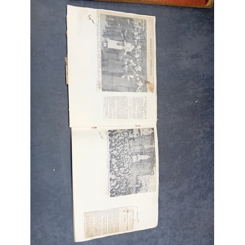 513 - A vintage, orange, spiral-bound scrapbook featuring a stylized 