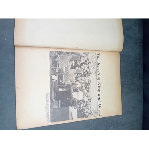 513 - A vintage, orange, spiral-bound scrapbook featuring a stylized 