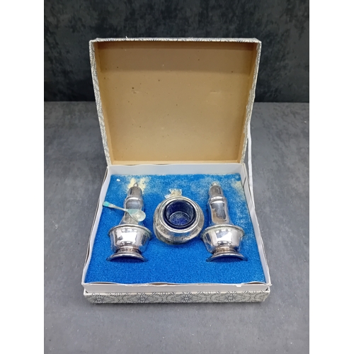 434 - A three-piece condiment or cruet set, likely dating from the mid-to-late 20th century. The set compr... 