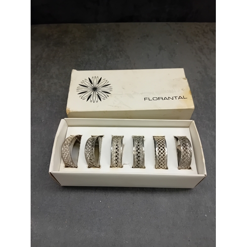 437 - A set of six vintage FLORANTAL silver-plated napkin rings. Each ring is crafted from a silver-toned ... 
