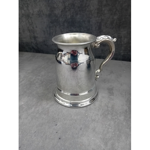 440 - A polished, reflective pewter tankard, identified by web intelligence as English pewter, likely from... 