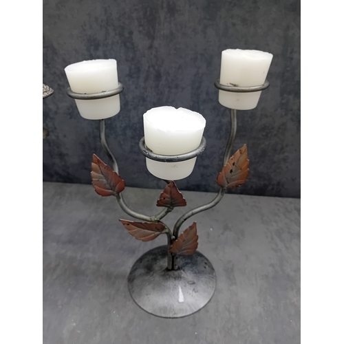 444 - A group of two candelabras. The first is a traditional style Ianthe silver-plated three-light candel... 