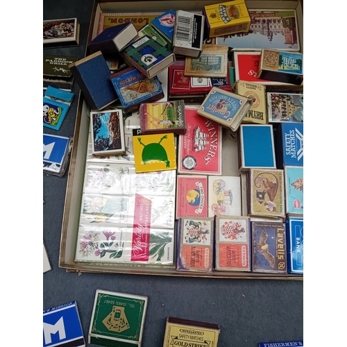 A diverse collection of vintage and collectible matchboxes and ...