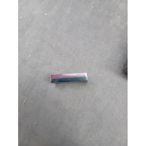 456 - A vintage cased set of red Bakelite and Catalin dominoes. The set features individual two-tone piece... 