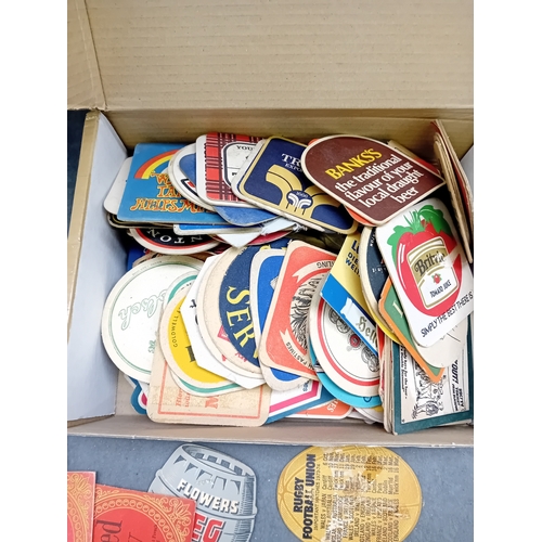 501 - A collection of approximately 50 vintage German beer coasters, primarily crafted from pulpboard or t... 