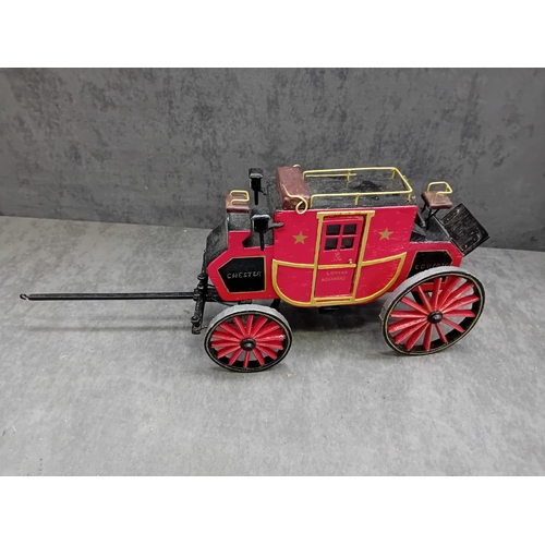 567 - A Wells Fargo & Co Overland Stage Coach designed as a painted wooden of a 19th-century style sta... 