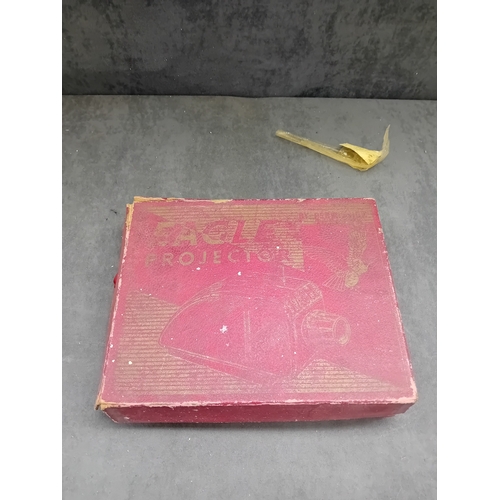 575 - A vintage Merit S.E.L. Ace 'EAGLE' film projector, likely dating from the mid-20th century. The proj... 