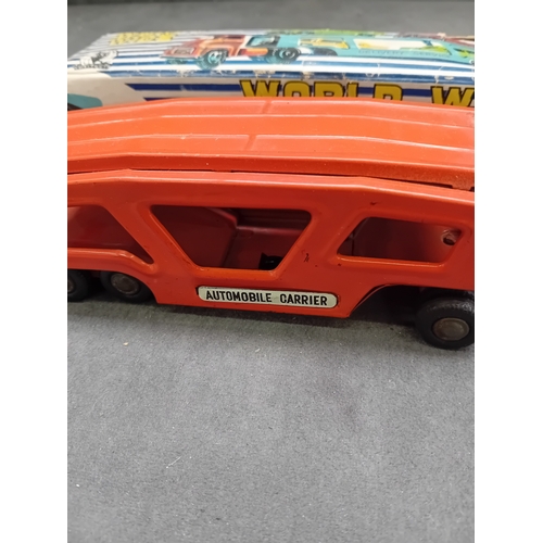 585 - A vintage Y4935 SSS tin friction automobile carrier truck and trailer set, manufactured in Japan. Th... 