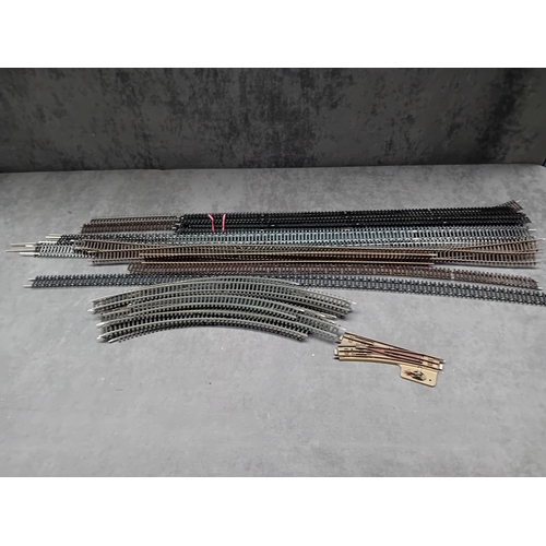 604 - A collection of Hornby and Peco HO/OO gauge model railway track sections, comprising various straigh... 