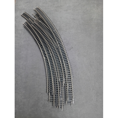 604 - A collection of Hornby and Peco HO/OO gauge model railway track sections, comprising various straigh... 