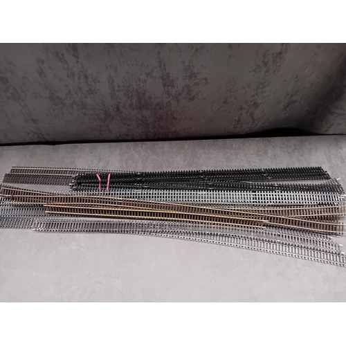 604 - A collection of Hornby and Peco HO/OO gauge model railway track sections, comprising various straigh... 
