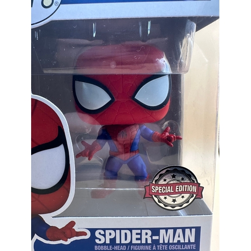 615 - A Funko Pop! Marvel 956 Spider-Man Special Edition bobble-head figure. The stylized plastic figure d... 