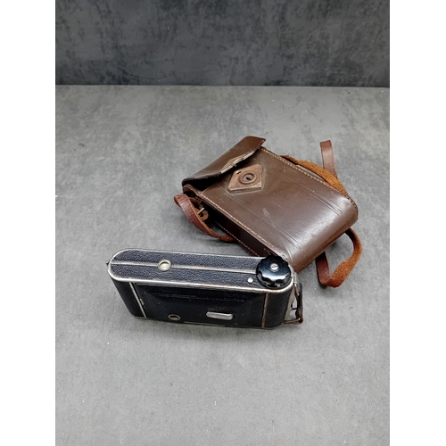 110 - This lot comprises a vintage J. H. L. Motor Dresden folding camera and an unbranded brown leather ca... 