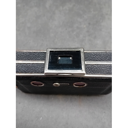 110 - This lot comprises a vintage J. H. L. Motor Dresden folding camera and an unbranded brown leather ca... 