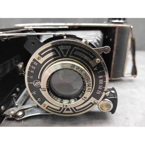 110 - This lot comprises a vintage J. H. L. Motor Dresden folding camera and an unbranded brown leather ca... 