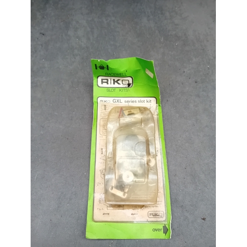 154 - A vintage RIKO GXL series slot kit, packaged on a vibrant green card backing with a clear plastic bl... 