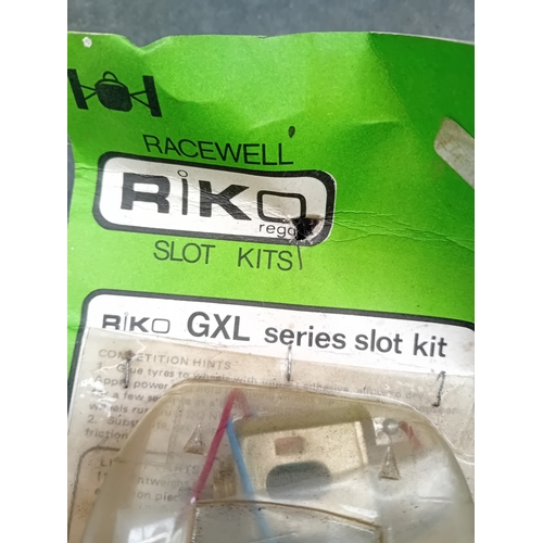 154 - A vintage RIKO GXL series slot kit, packaged on a vibrant green card backing with a clear plastic bl... 