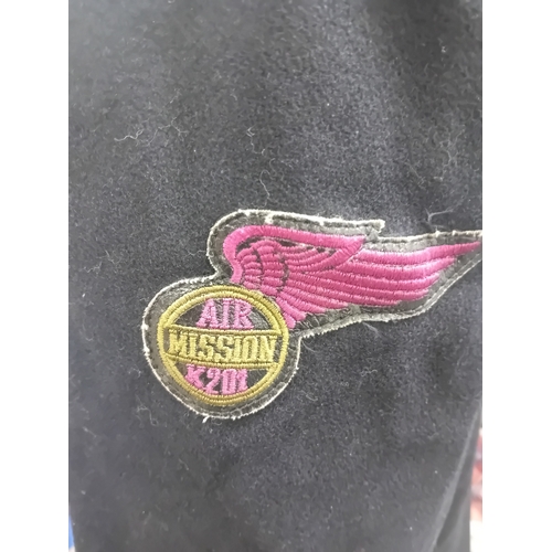 18 - A navy blue duffle coat, likely constructed from a wool or wool-blend fabric, featuring a hood with ... 