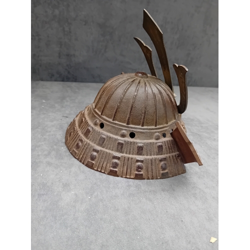20 - A Vintage Japanese Miniature Samurai Kabuto Helmet, constructed from dark brown, heavily textured ca... 