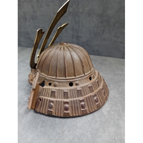 20 - A Vintage Japanese Miniature Samurai Kabuto Helmet, constructed from dark brown, heavily textured ca... 