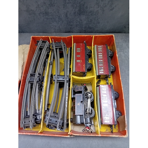 221 - A Hornby Gauge O clockwork Tank Passenger Set No. 41, manufactured by Meccano Ltd. in Liverpool, Eng... 