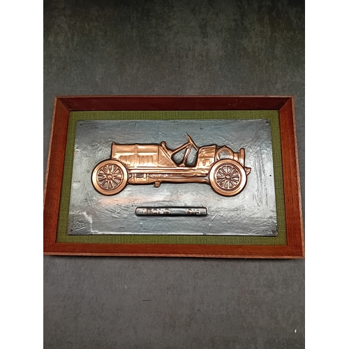 266 - A framed hand-wrought repoussÃ© metal relief depicting an ITALA 1913 automobile. The car is rendered... 