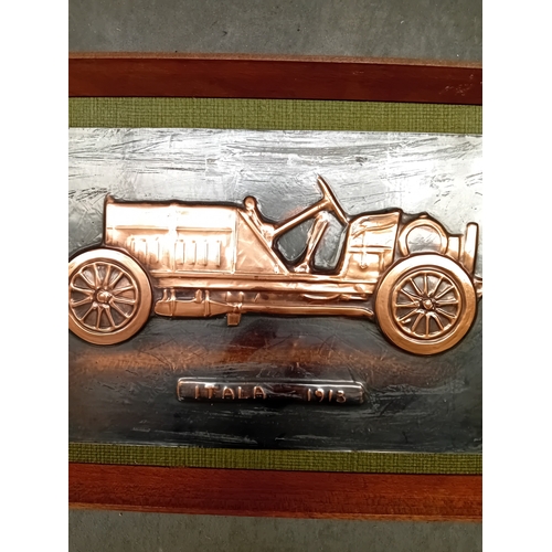 266 - A framed hand-wrought repoussÃ© metal relief depicting an ITALA 1913 automobile. The car is rendered... 