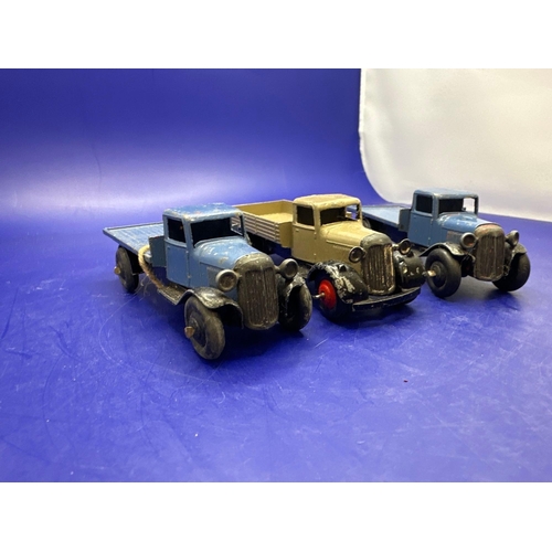 312 - 3 x Dinky flat Bed Trucks as pictured. Unboxed.